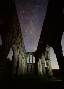 Rievaulx abbey at night milky way under the arches